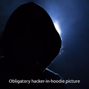 Silhouette of a person in a hoodie against a blue-lit background; the image links to a related video.