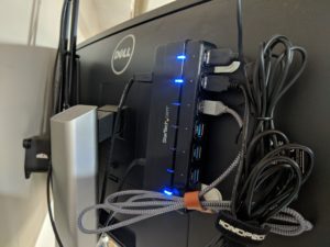 The space behind a monitor on the home office desk.